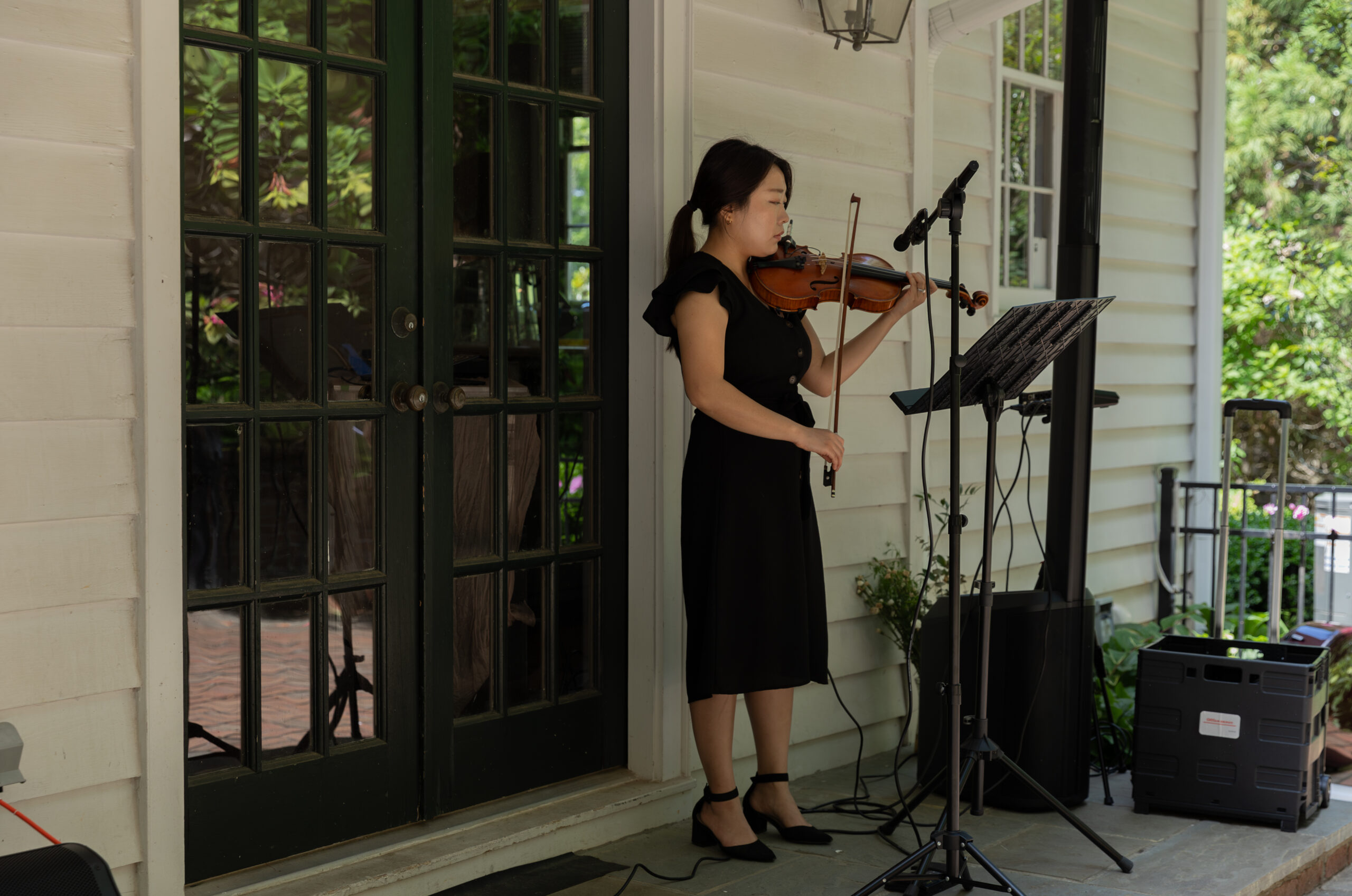 Live wedding violinist playing at the ceremony of an all inclusive wedding at the 716 West, formerly known as the Mary Gay House, wedding venue in Decatur, GA.