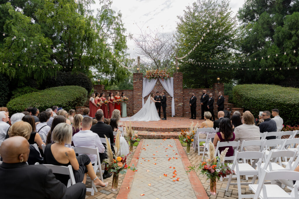 Outdoor wedding ceremony at The Carl House in Auburn, GA.