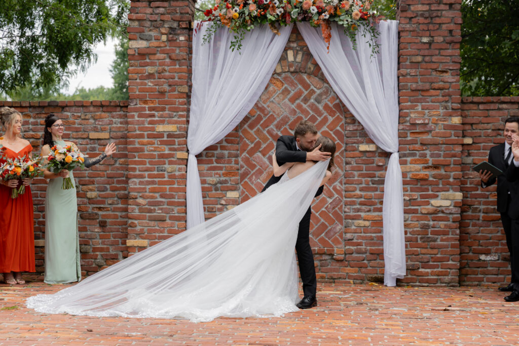 The bride and groom during their first kiss at the ceremony.