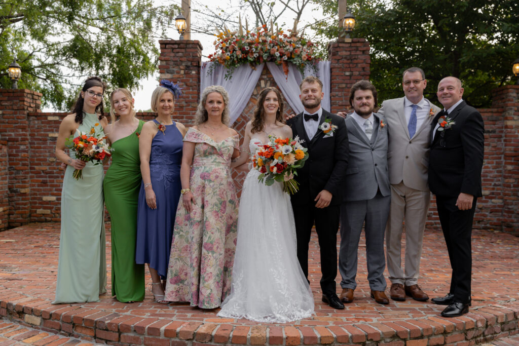 A family portrait moment with the bride and groom.