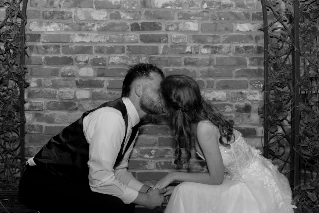 A black and white photo of the bride and groom during some portrait photos.