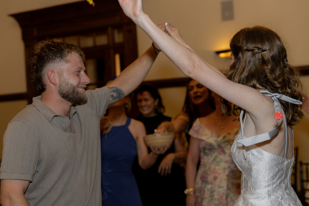The bride and groom dancing together during the wedding reception.