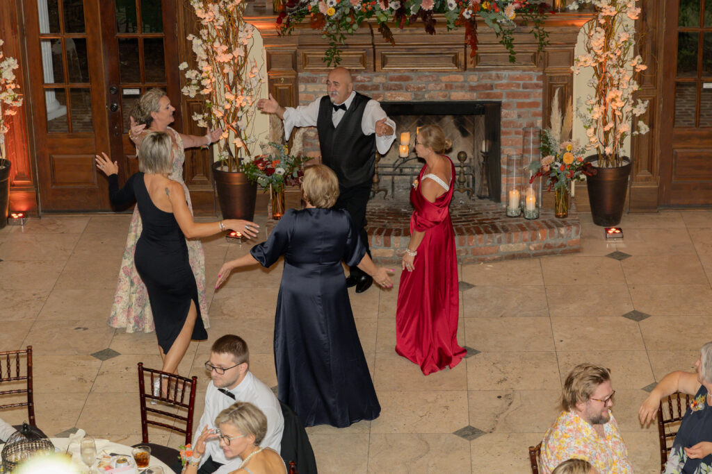 A candid moment of family dancing during the wedding reception.