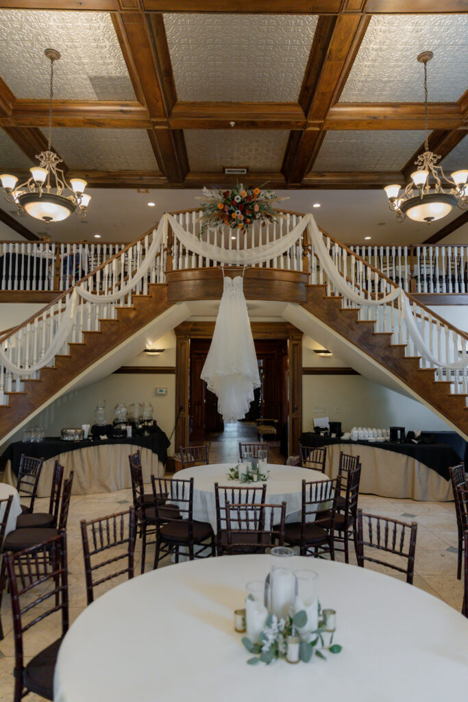 The bride's dress hanging down from the stairwell of The Carl House.
